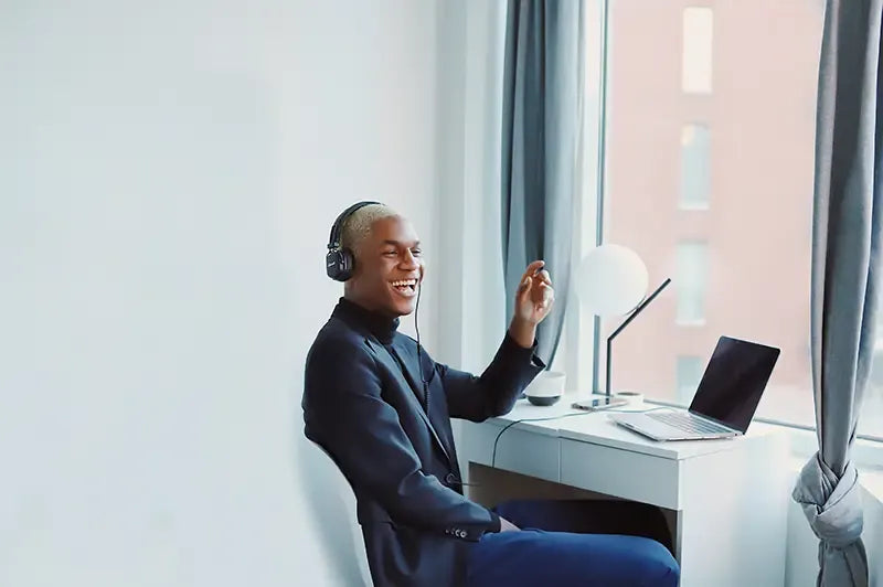 man working smiling laptop