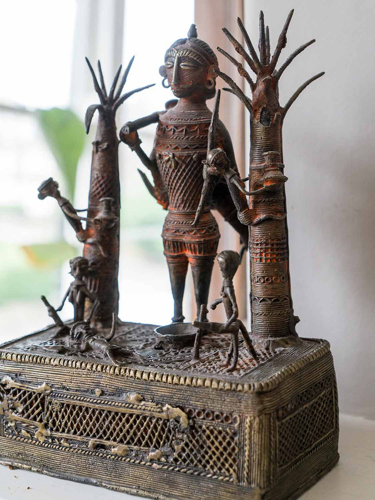 Brass Sculpture of a Hunter and Villagers