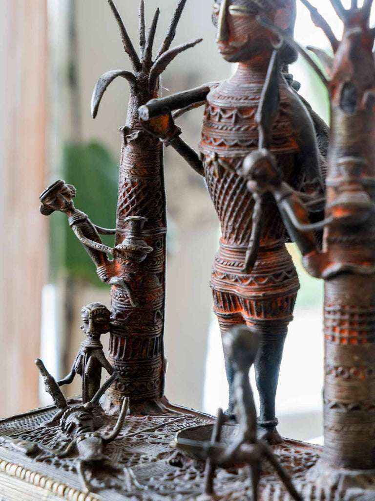 Brass Sculpture of a Hunter and Villagers 2