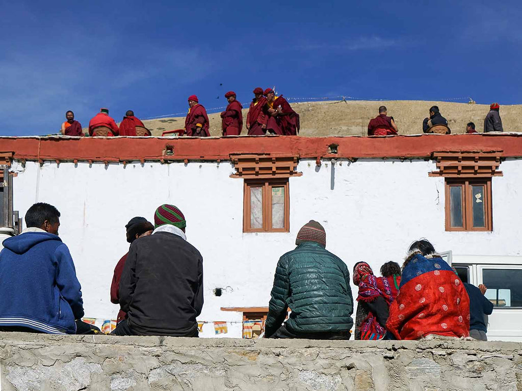 Monks on the roof, Korzok monastery, Ladakh