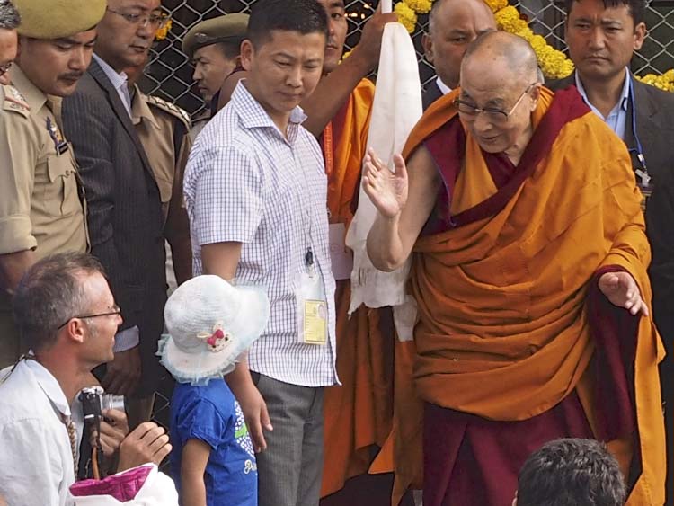 The Dalai Lama Greeting a Child in Leh