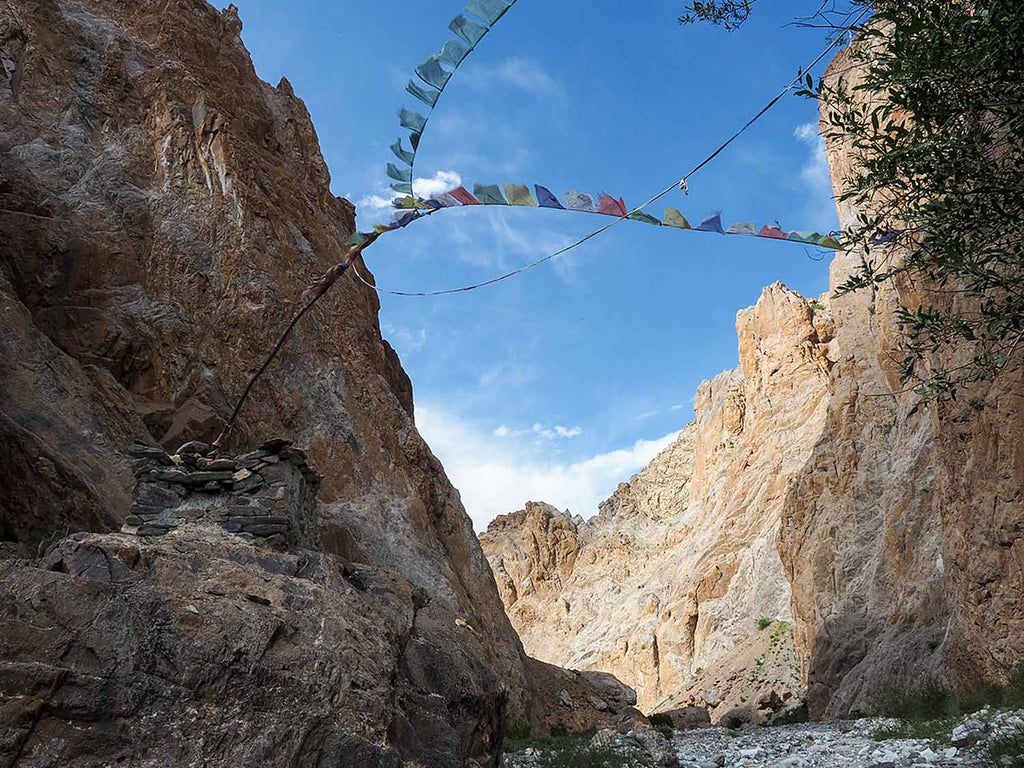 Prayer Flags across the Boulders in the Canyon
