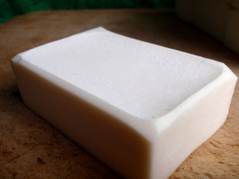 a single bar of white soap with beveled edges