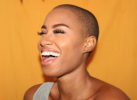 woman smiling due to increased serotonin with supplements