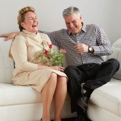 senior men and women on couch wearing adaptive clothes