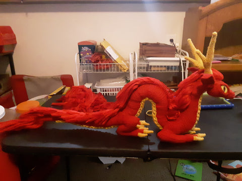 profile of handmade red dragon by author Nikki Haras