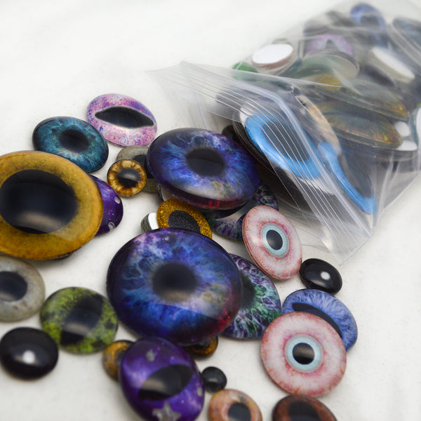 random 1/2 pound lot of glass eyes for handmade crafting