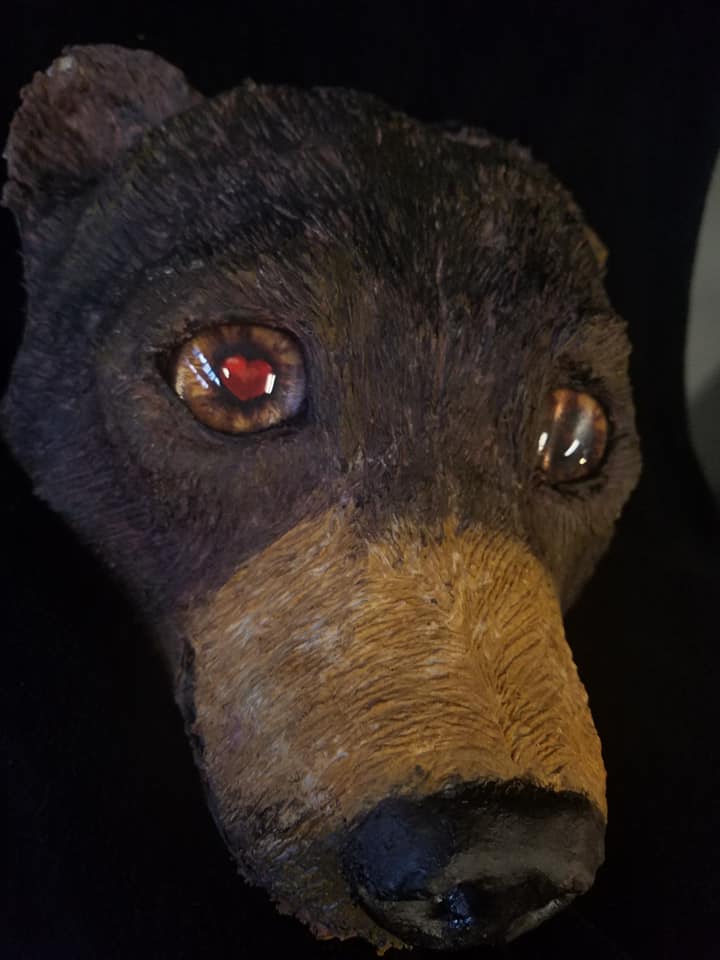 bear sculpture with animated heart glass eyes