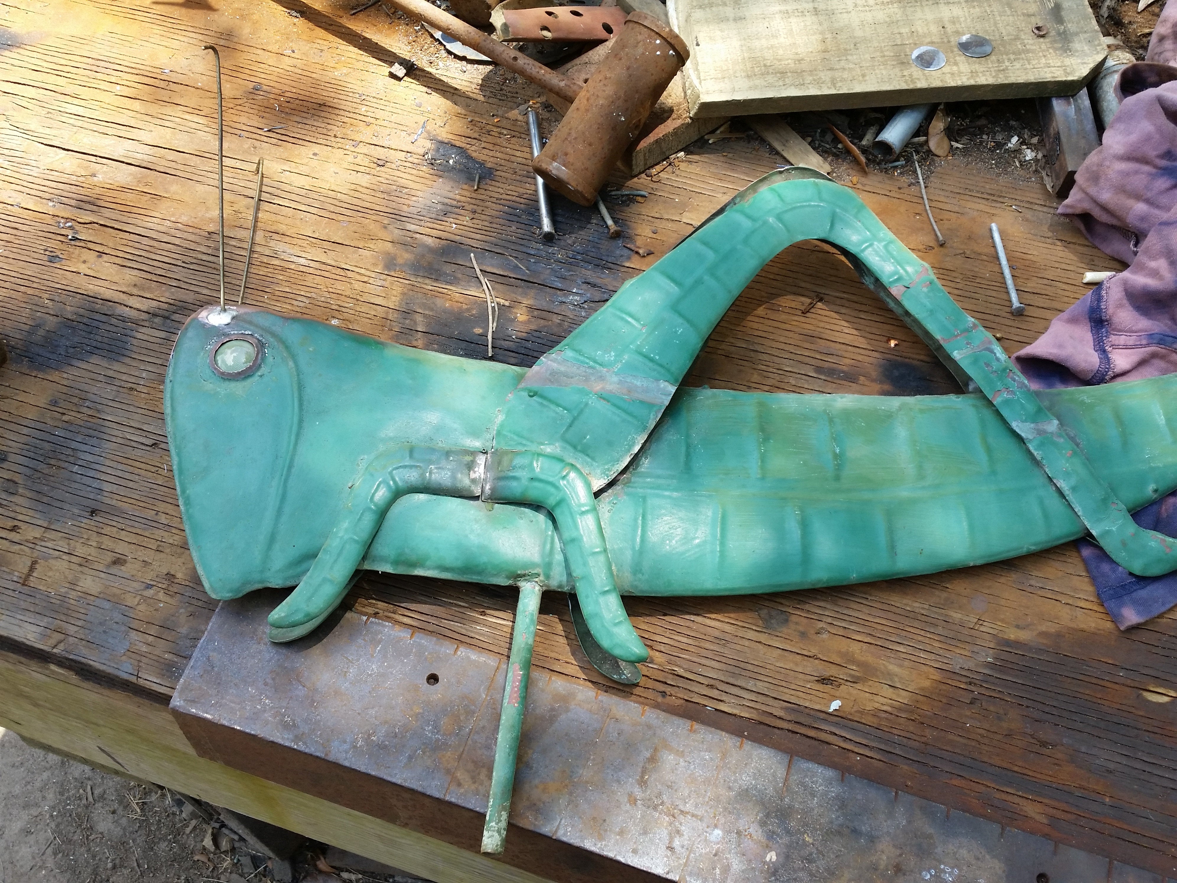 restored weather vane grasshopper with glass insect eyes
