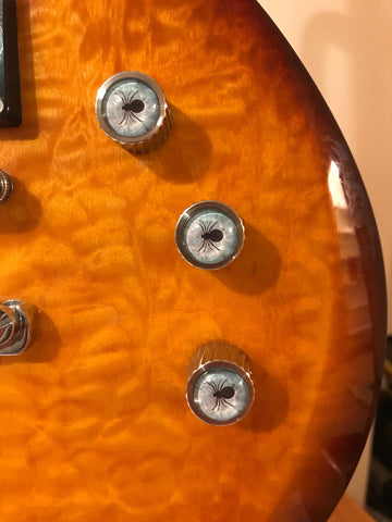 guitar with steel knobs