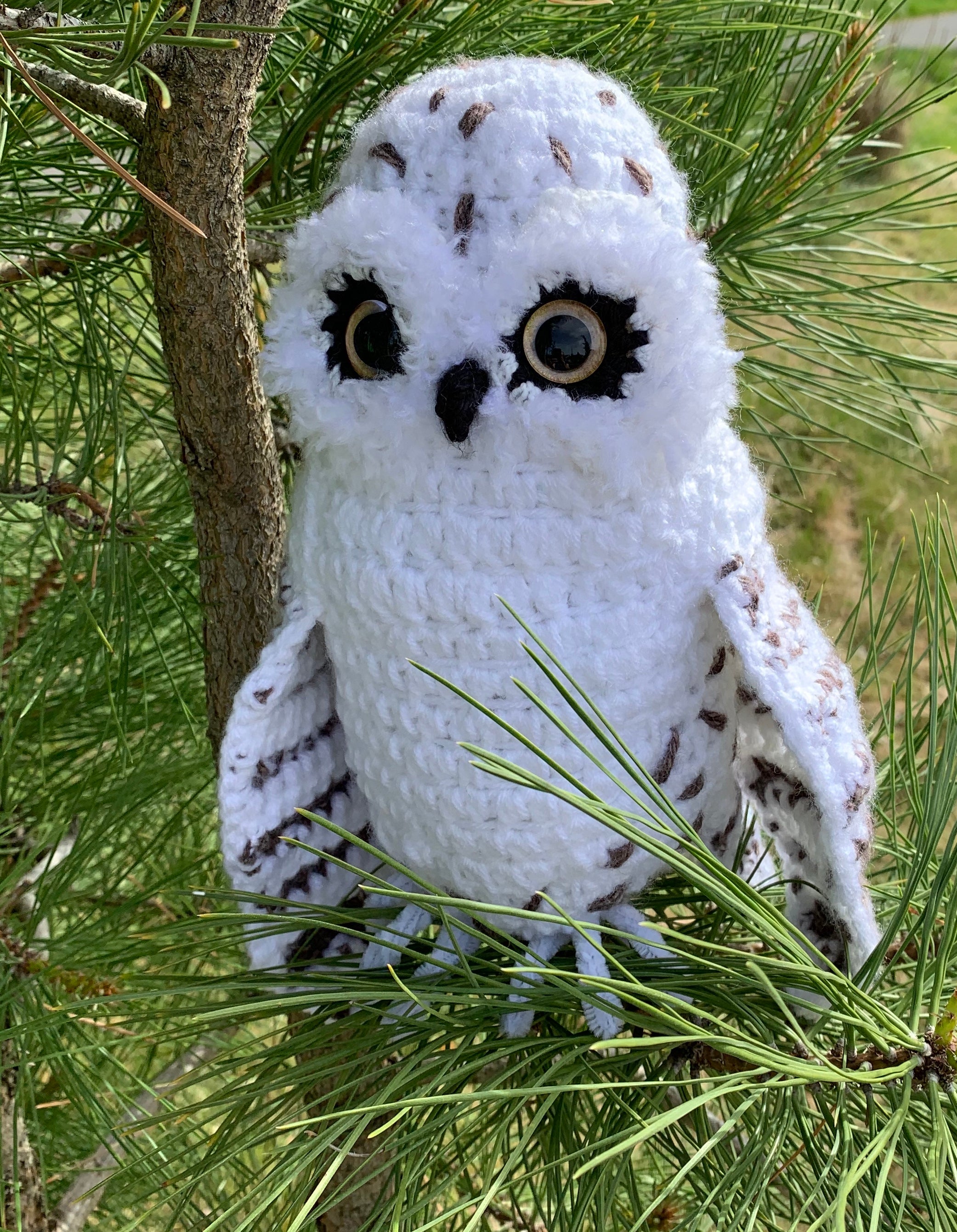 white and speckled handmade owl toy with plastic safety eyes
