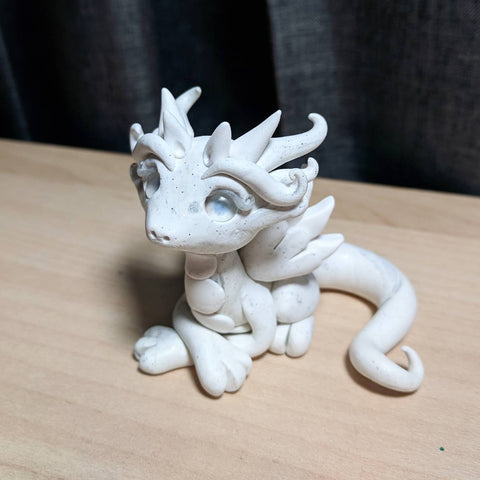 white polymer clay dragon sculpture