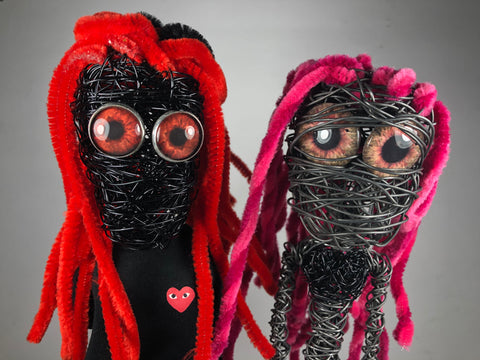 wire sculptures with glass eyes