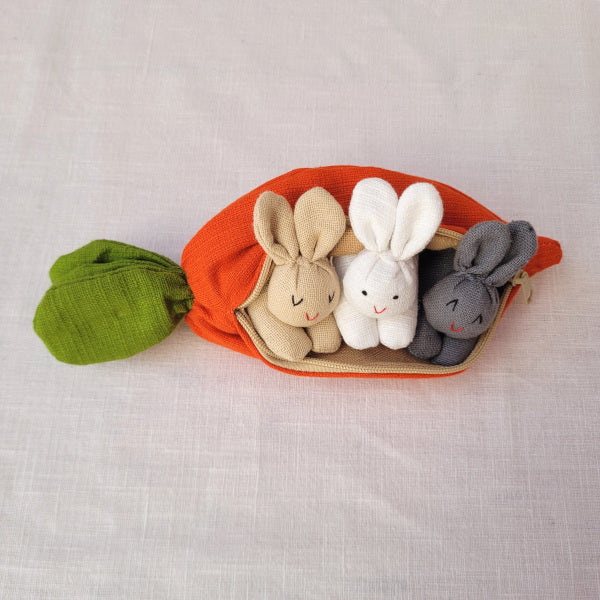 three bunnies in a carrot purse