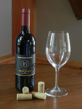 photo of red wine in bottle