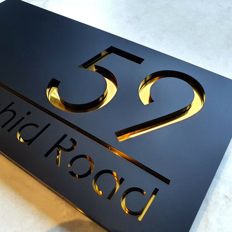 gold and black address house sign