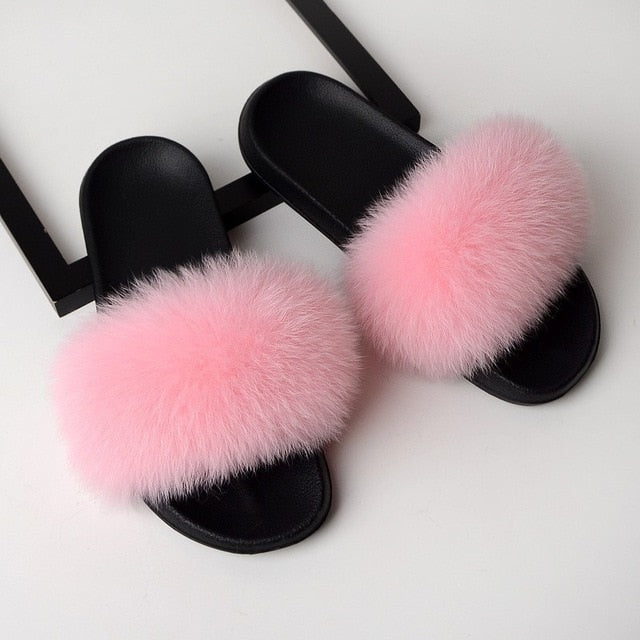 pink and black fur slides