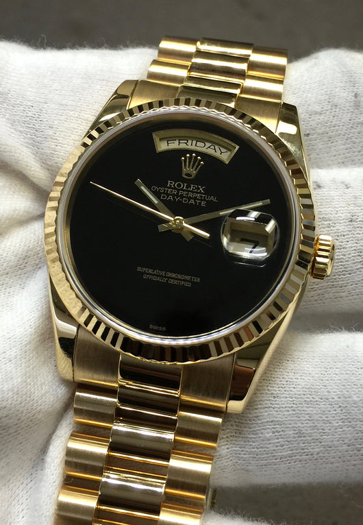 rolex oyster perpetual day date gold black face