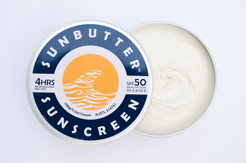 Image of a tin of SunButter sunscreen against a white background.