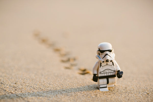 The lowdown on free radicals, antioxidants and your skin. An image of a Lego storm trooper marching along sand