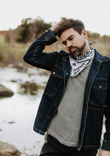 a man with a beard and a scarf on his head