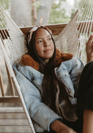 a person wearing a head scarf