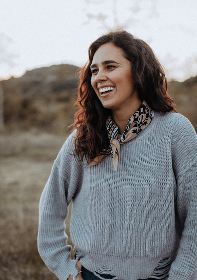 a woman smiling at the camera