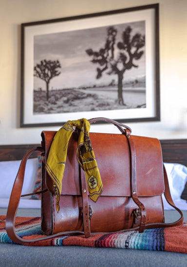 a suitcase with a picture on the wall