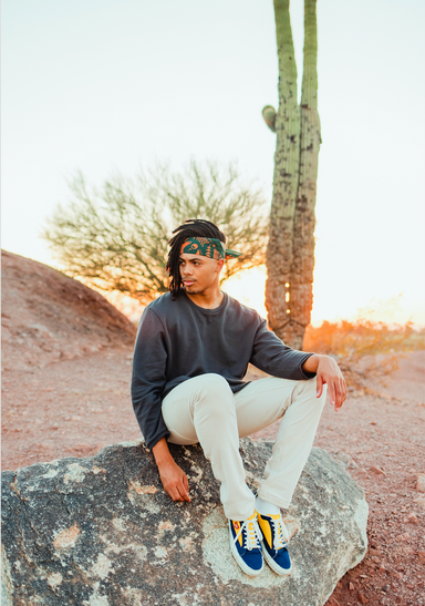 a man sitting on a rock