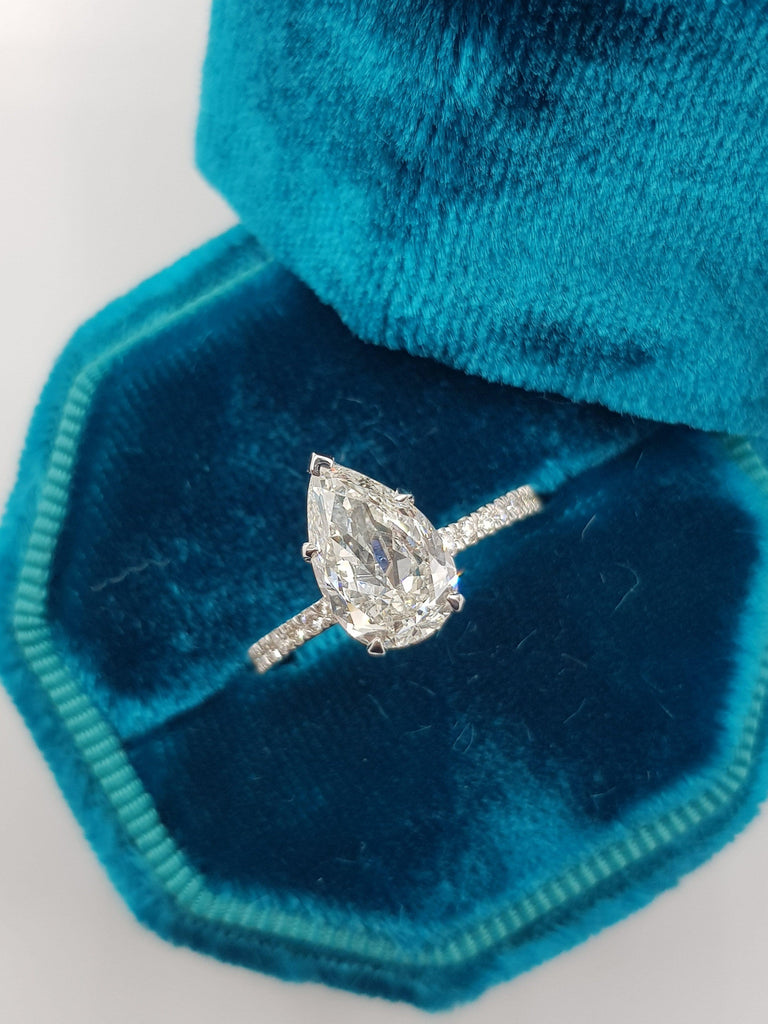 pear shaped hidden halo engagement ring