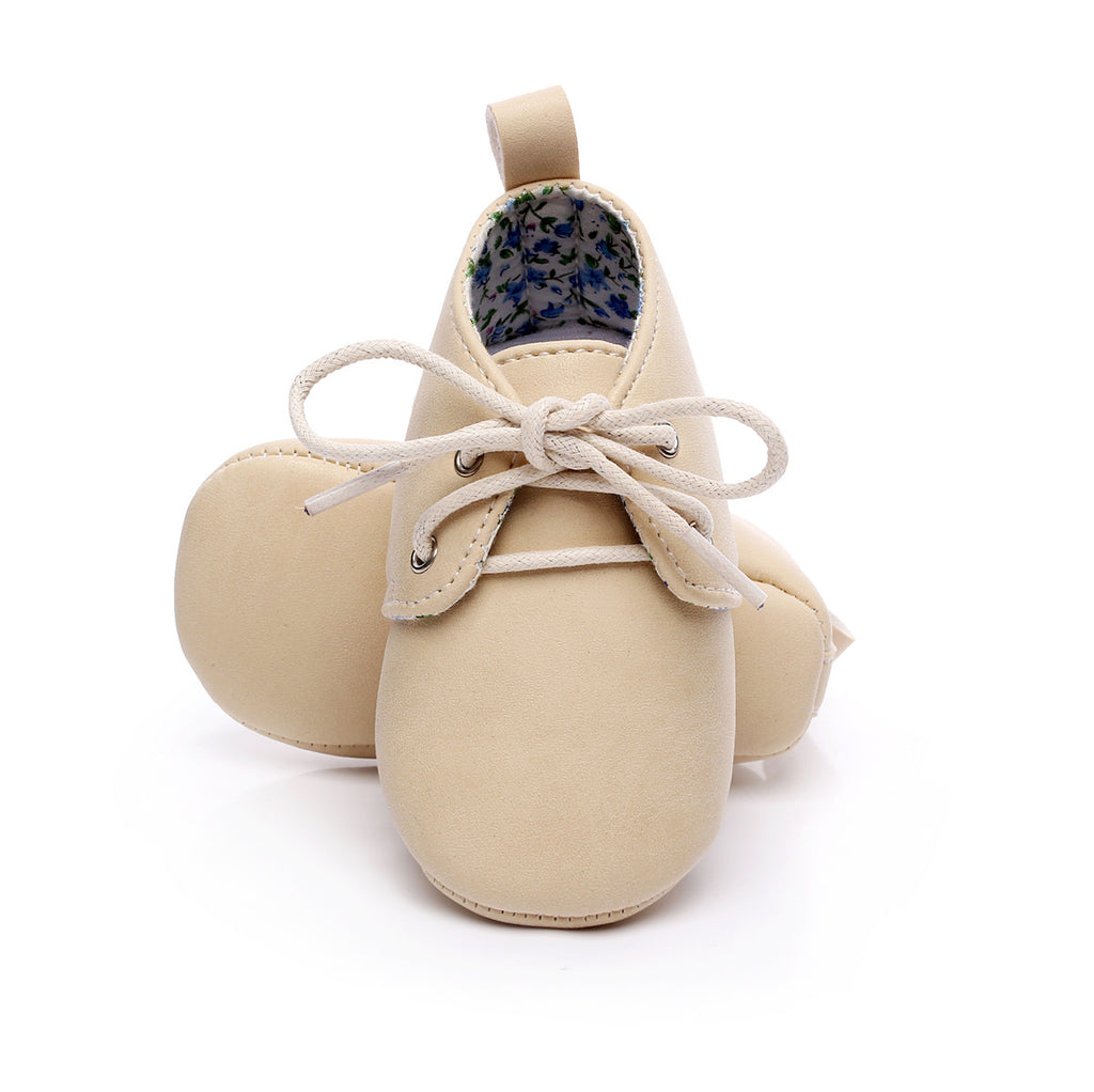 beige baby shoes