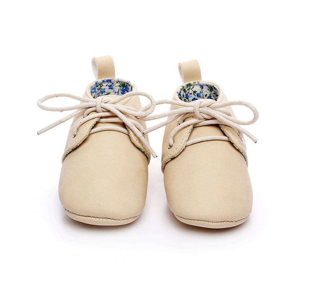 beige baby shoes