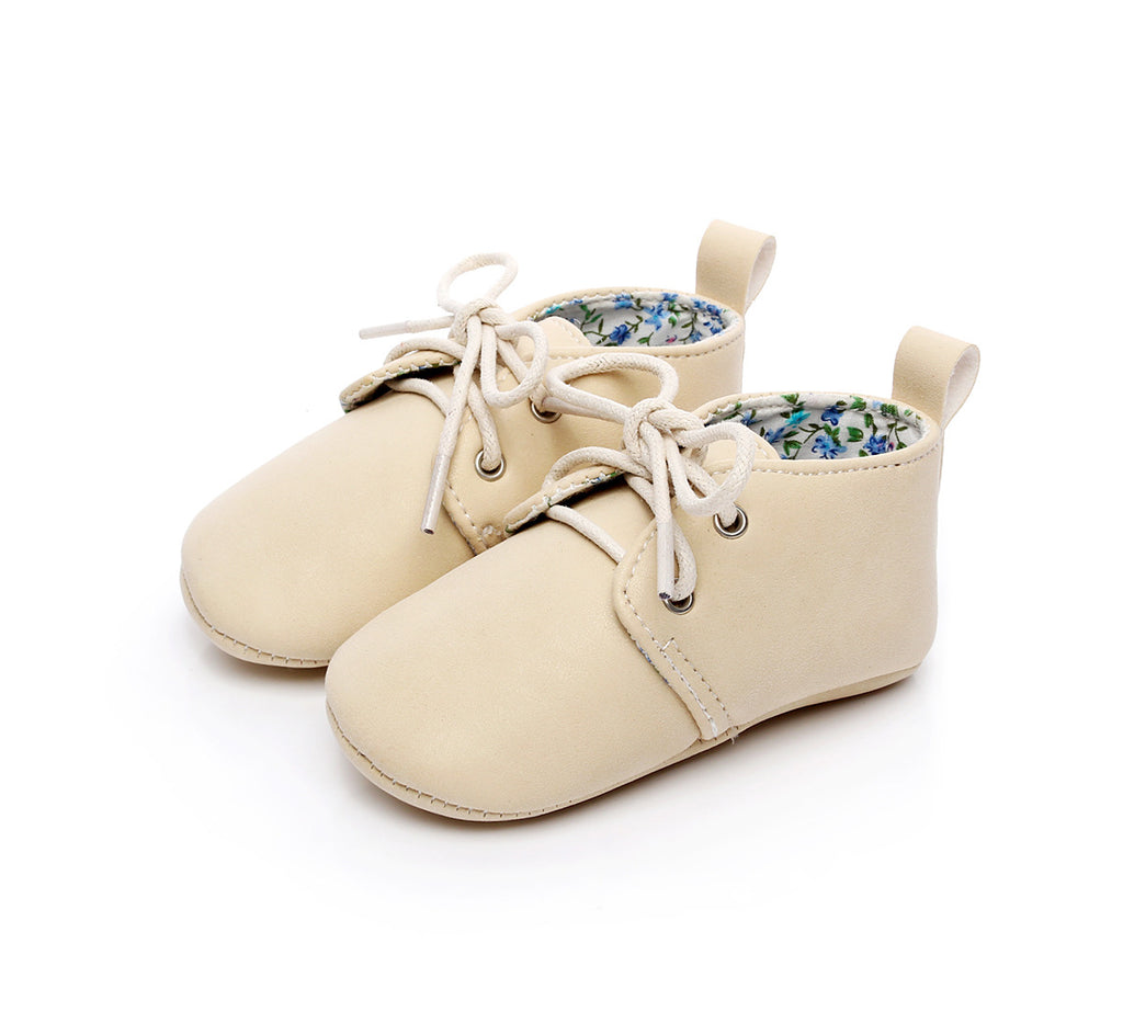 beige baby shoes