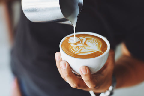 Coffee being poured latte