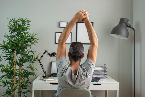 stretching at work desk