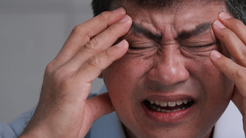 Man suffering with chronic headache