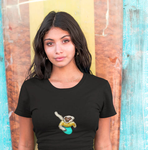 woman wearing an organic cotton t shirt with a surfing gibbon on the front.