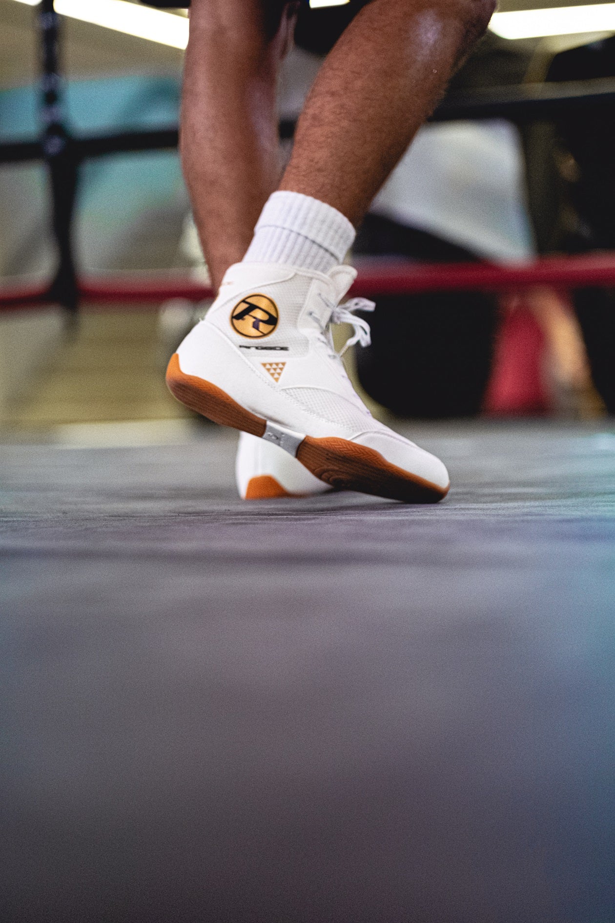 Closeup of boxing boots in boxing ring