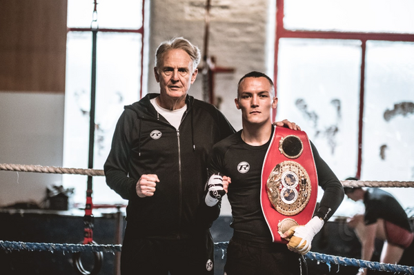 David Hill and Josh Warrington standing in boxing Ring