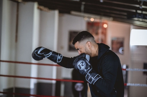 Sam Maxwell Boxer punching wearing boxing gloves