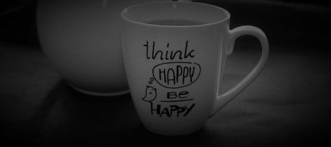 Mug with the phrase "think happy be happy"