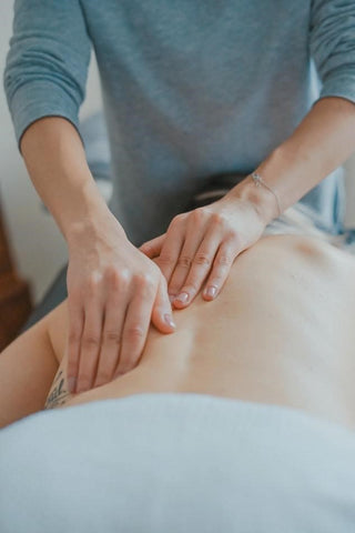 Person getting a back massage.