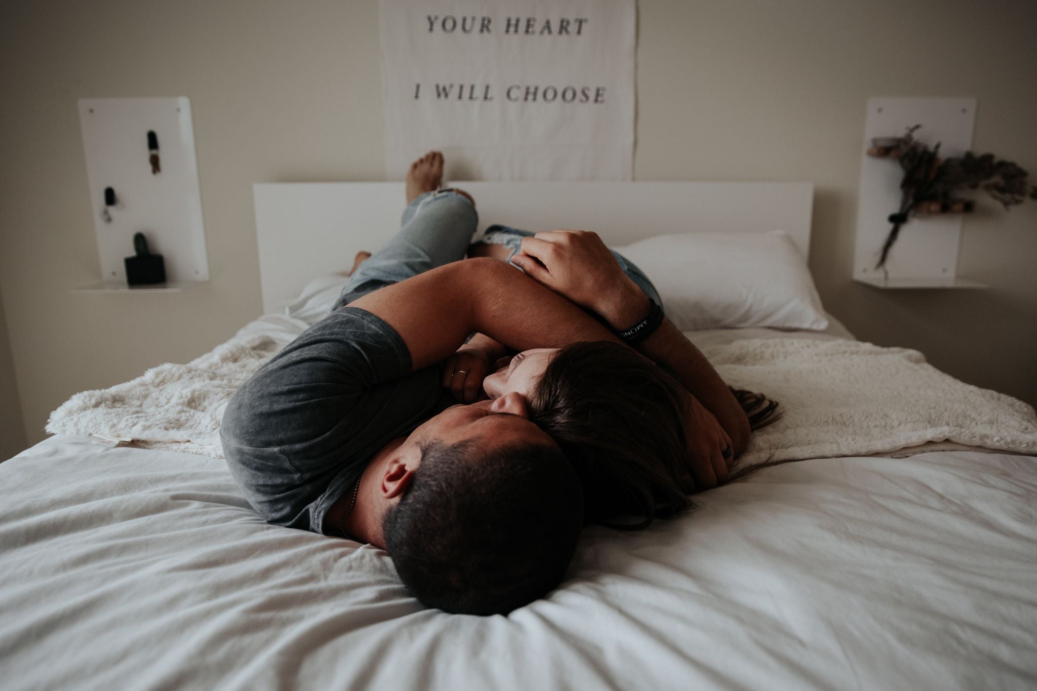 couple lying in bed and hugging
