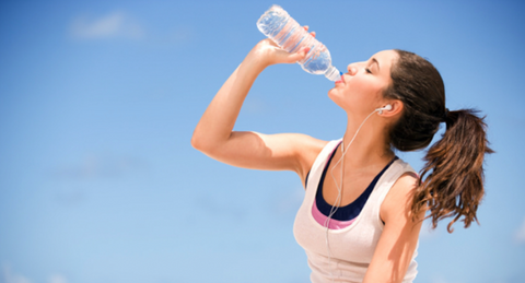 Woman drinking water.