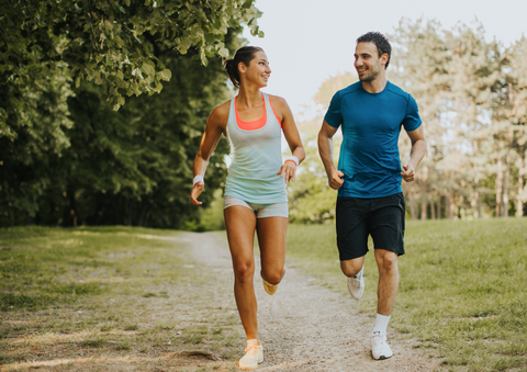 Couple running outdoors.