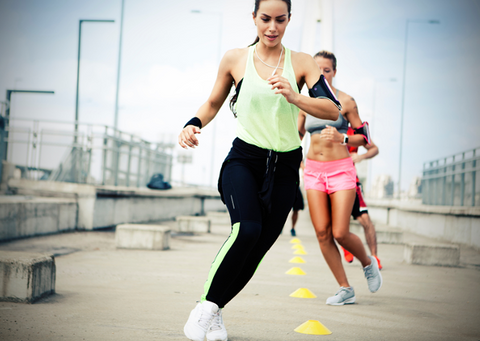 Group of people exercising outdoors.