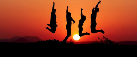 People jumping during sunset