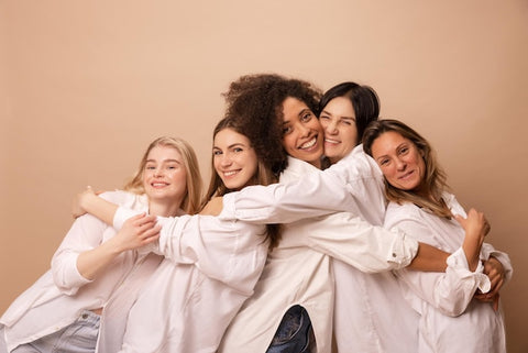 Women hugging each other.