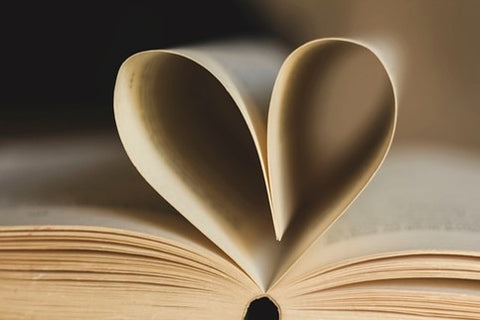 Book pages forming a heart.