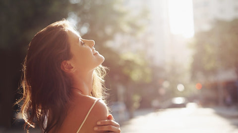 Woman enjoying sun on her skin